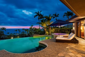 As day turns to night, our pool offers a serene oasis bathed in the gentle light of dusk.