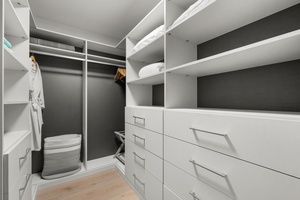 Your spacious walk-in closet offers ample storage with custom shelving, drawers, and hanging space to keep your belongings perfectly organized.