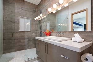 Rejuvenate in this modern bunk room ensuite, complete with sleek finishes, a spacious shower, and vibrant touches of color for a refreshing start or end to your day.