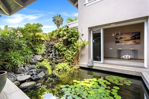 Koi pond fountain within the atrium of the home