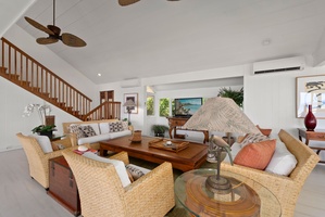 Your spacious living room has comfortable seating, warm wood accents, and tropical touches that create the perfect island getaway atmosphere.