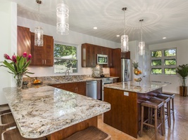 Beautiful granite counters with ample seating.