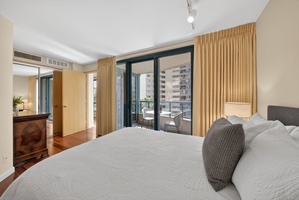 Retreat to this peaceful bedroom with floor-to-ceiling windows and private lanai access.