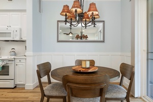 The formal dining space features warm wood tones and plantation-style charm for shared meals.