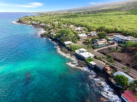 See the turquoise waters and charming shoreline community that surrounds The Cottage.