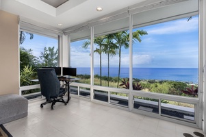 Your inspiring workspace awaits with panoramic ocean views through floor-to-ceiling windows, where tropical palm trees frame endless blue horizons.