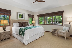 Tennis house guest bedroom featuring a king-size bed, elegant furnishings, and tranquil ambiance.