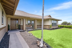 Covered patio opens to a private green space and sunshine.