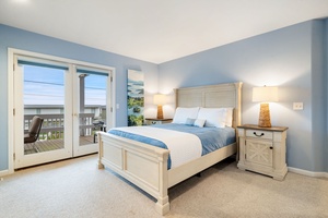 Drift off in your serene coastal bedroom, where soft blue tones and crisp linens create the perfect retreat after beach days.