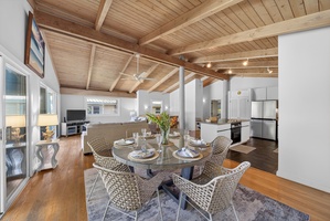 Gather for meals in the airy dining space beside the open-concept kitchen.