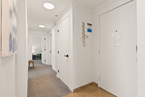 Entry hallway leading to your peaceful retreat, setting the tone for your relaxing coastal getaway.