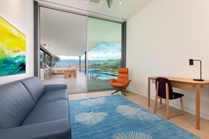 The office provides a fold out queen sleeper and dedicated workspace with views.