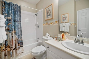 The second guest bathroom with a shower and tub combo.