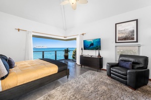 Primary suite with king bed, TV, and direct access to your private oceanview lanai.