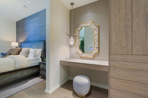 Your private retreat features a stylish vanity area with elegant mirror where you can prepare for your day in comfort.
