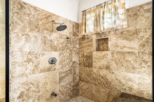 Walk in travertine shower