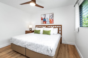 The guest bedroom offers a flexible setup and peaceful retreat after a day of beach adventures.