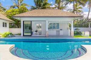 Circular pool with direct access to the pool house and guest quarters.
