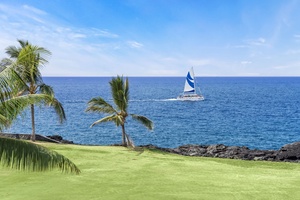 Watch sailboats glide by from the yard with stunning coastline views.