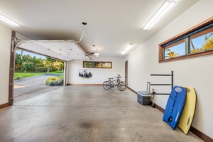 Spacious two-car garage featuring neatly stored sports equipment and secure parking.