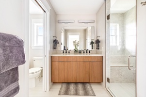 Upstairs ensuite bathroom 3 with dual vanities and shower