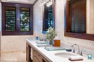 Refresh in the ensuite bathroom with double sinks and ample counter space.