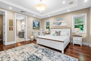 Bright guest suite with coastal tones and refined tropical design.