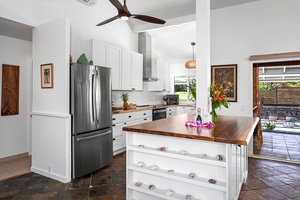 Stainless appliances and a center island give the kitchen room for real cooking.