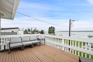 Spacious water view deck with comfortable seating where you can unwind and soak in stunning lake views.