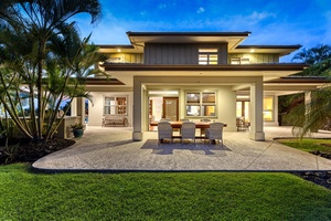 Elegant outdoor dining and lounge area with seamless access to the home’s interior.