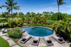 Soak up the island sun by the pool.