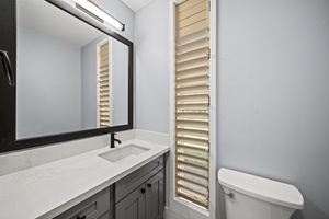 Start the day at a sleek vanity with modern fixtures and clean, bright finishes.