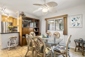 Dining room is equipped with a stocked liquor cabinet