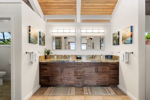 Unwind in a spa-like bathroom with a double vanity and warm, natural finishes.