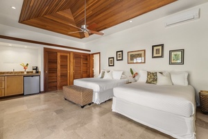 Guest House has separate courtyard entrance and is furnished with 2 Queen Beds, Wet-Bar, Smart TV, and Pool Access
