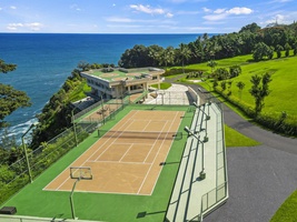 Enjoy a match on the private tennis and basketball court with ocean views.