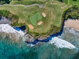 This aerial view of Kapalua Ridge Villas Resort highlights the lush golf course, right along the stunning coastline.
