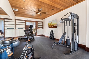 Your private air conditioned fitness space awaits with premium equipment, warm wood ceilings, and motivating views to keep you energized.