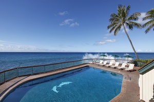Immerse yourself in Poipu Shores' pool, perched precariously by the mesmerizing Cliff's Edge!