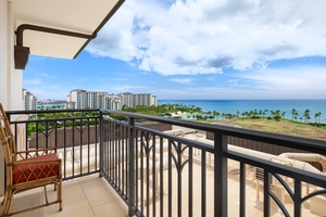 Panoramic ocean views stretch endlessly from this private lanai, where tropical palms frame turquoise waters below.