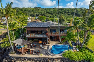 Stunning oceanfront estate with lush landscaping and breathtaking views.