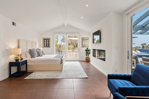 Primary Bedroom pool side with two walls accessing the outdoors