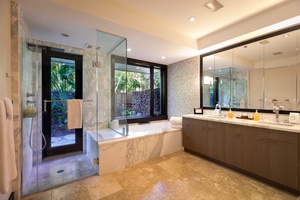 Indulge in a luxurious ensuite bath designed for total relaxation.