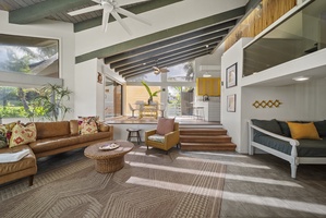 Relax in the inviting living room, designed for comfort with plush seating and natural light.