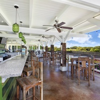 The bar at Poipu Beach Athletic Club offers a relaxed atmosphere for refreshing drinks with a view.