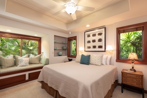Doze off in your peaceful King bedroom sanctuary with tropical garden views, plush linens, and a cozy window seat perfect for morning coffee.