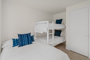 Third bedroom with full bed and bunk bed—perfect for families.