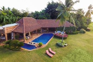 Stunning aerial view of Costa Verde 6, featuring its well-manicured lawns and cozy outdoor seating areas.