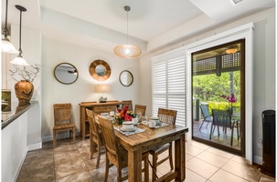Dining area with sliding glass doors to the private lanai