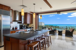 Cook meals while gazing at stunning ocean views from your modern kitchen with granite counters and premium appliances.